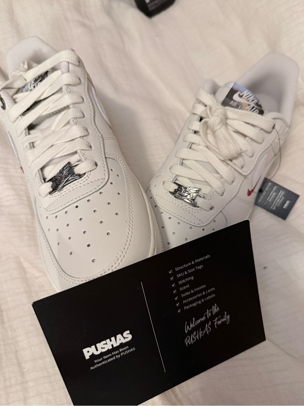 Nike Men’s White Leather Low-Top Sneakers with Small Red Swoosh